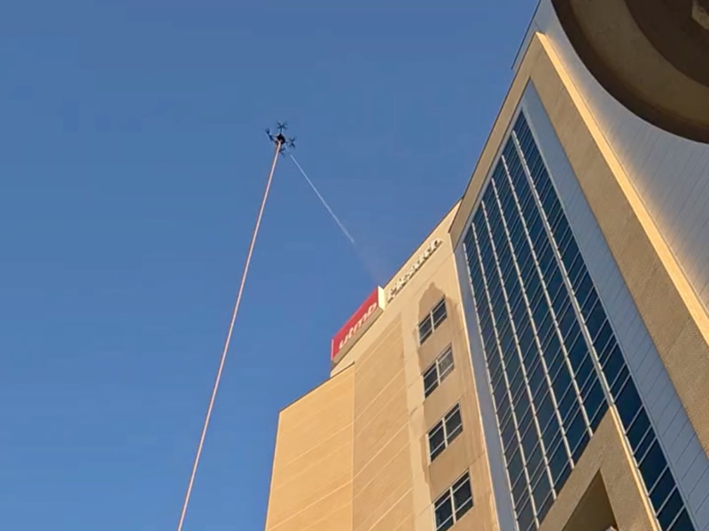 Drone cleaning large Galveston hospital exterior